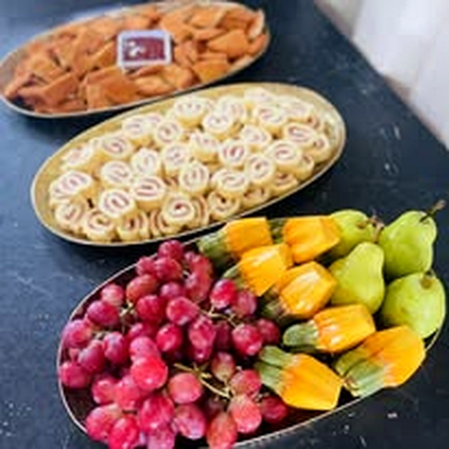 Fruit and sweet rolls on catering trays