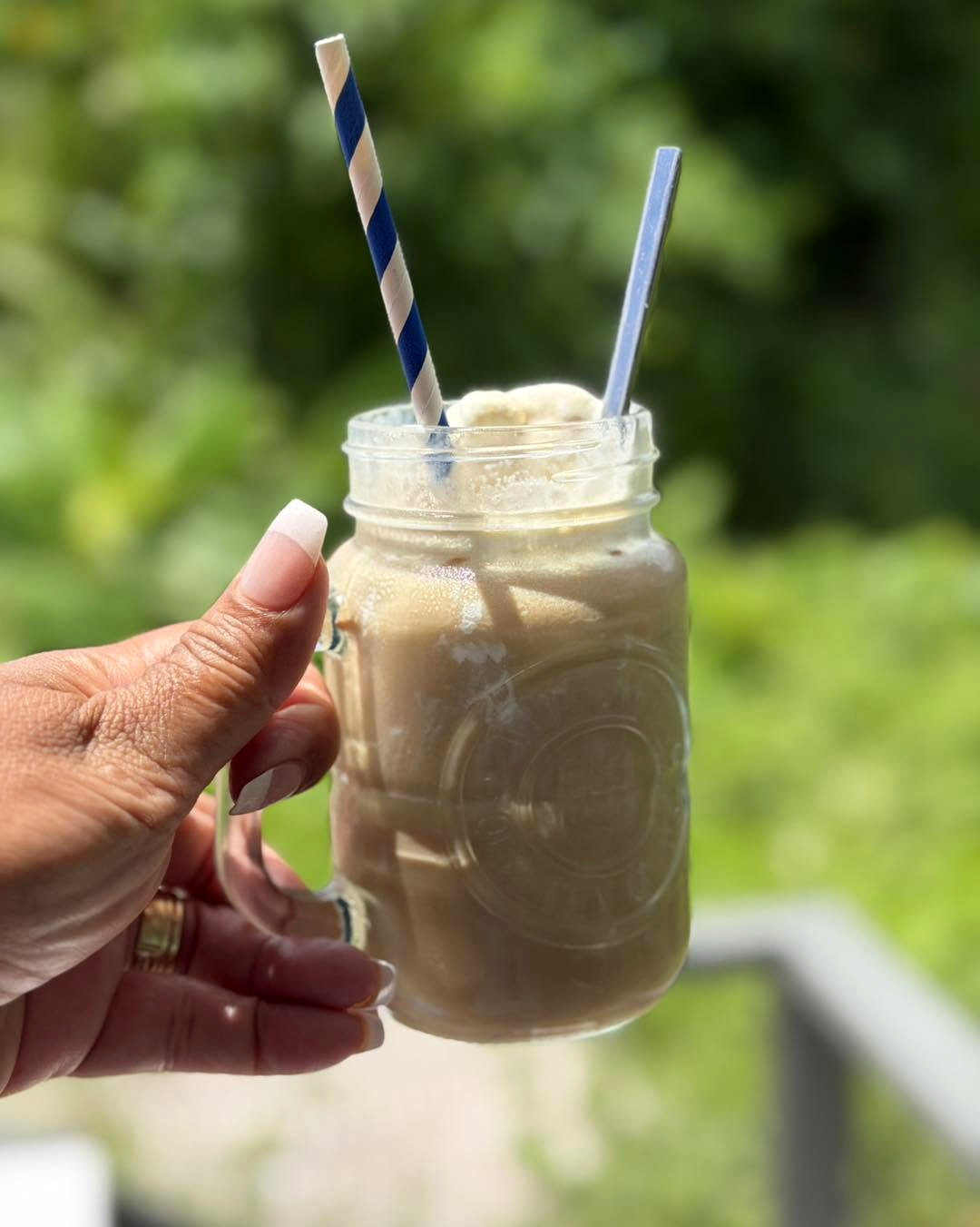 Cold milkshake in a glass jar