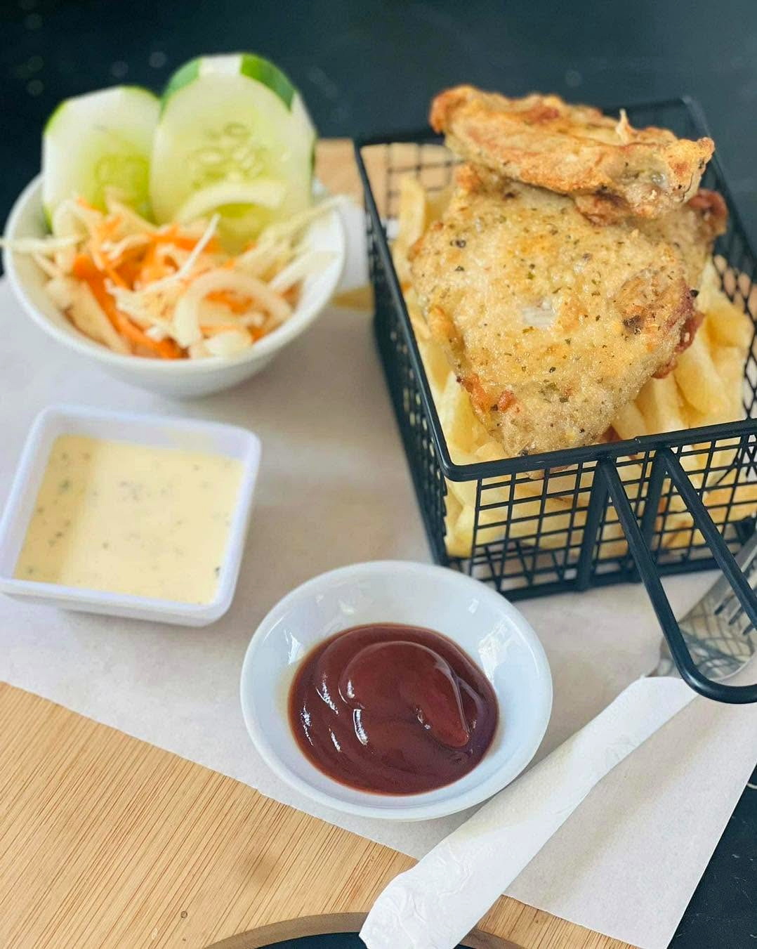 Fish and chips with salad and sauces